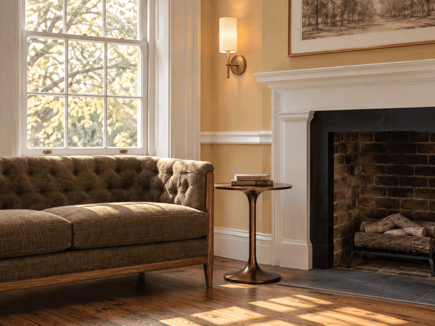 Heritage King Accessible guest room at Sabal House Inn in historic Savannah, featuring a comfortable sitting area, classic tufted sofa, original fireplace, and natural light.