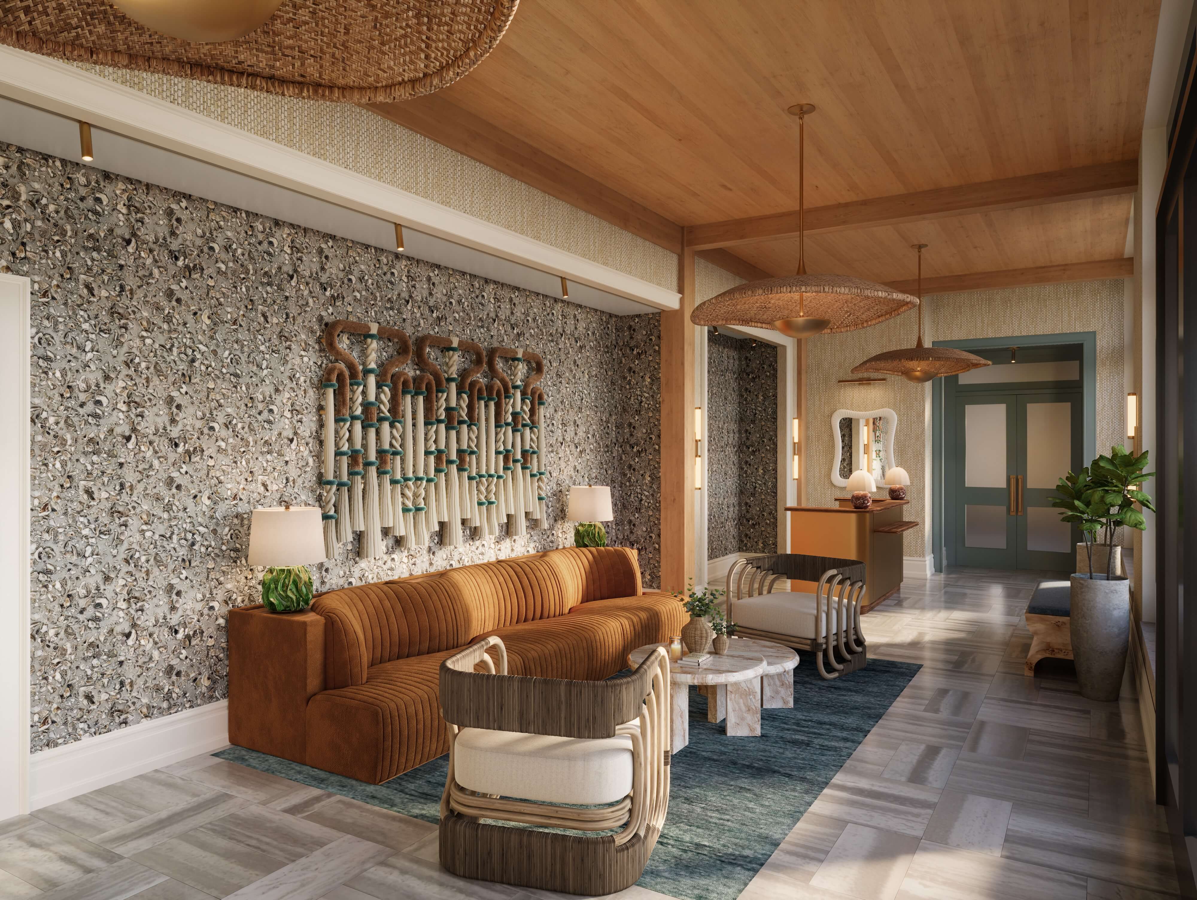 Elegant guest lobby at Sabal House Inn in Savannah's Historic District, featuring coastal-inspired decor, a textured oyster shell wall, and luxurious lounge seating.