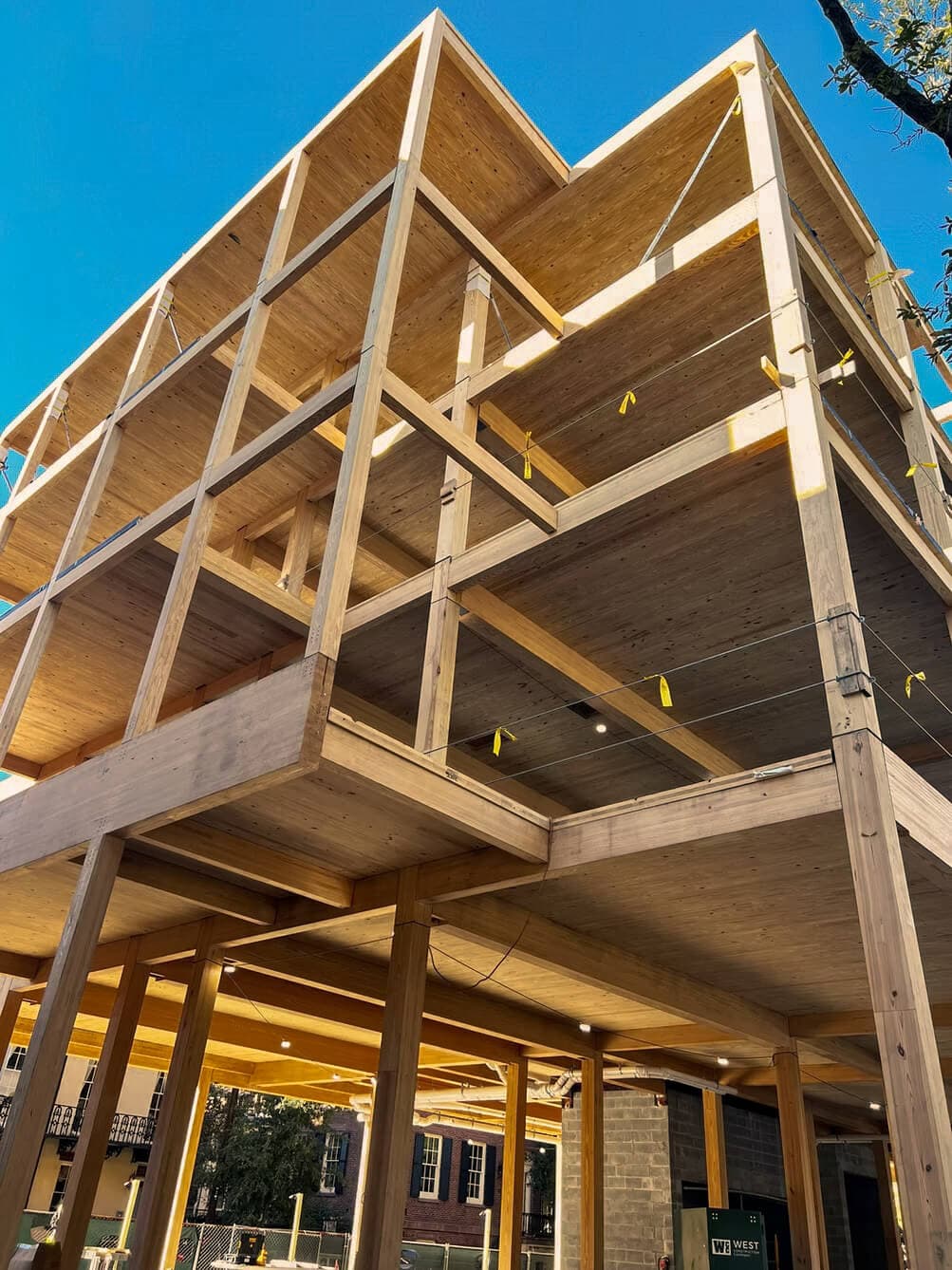 Mass timber construction featuring Georgia yellow pine structural beams during the development of Sabal House Inn in historic Savannah, Georgia.